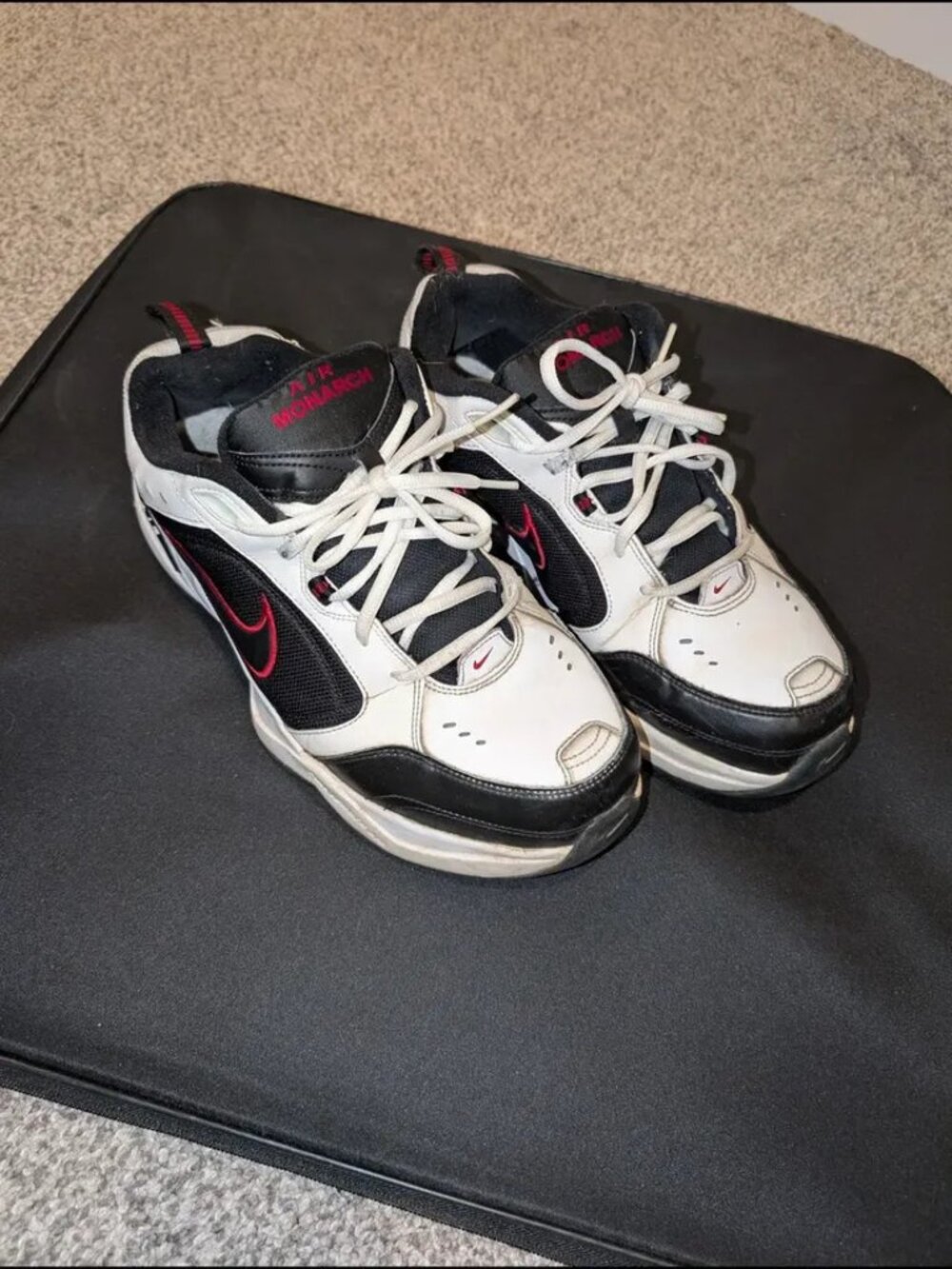 Nike Air Monarch IV shoes in white, black, and red